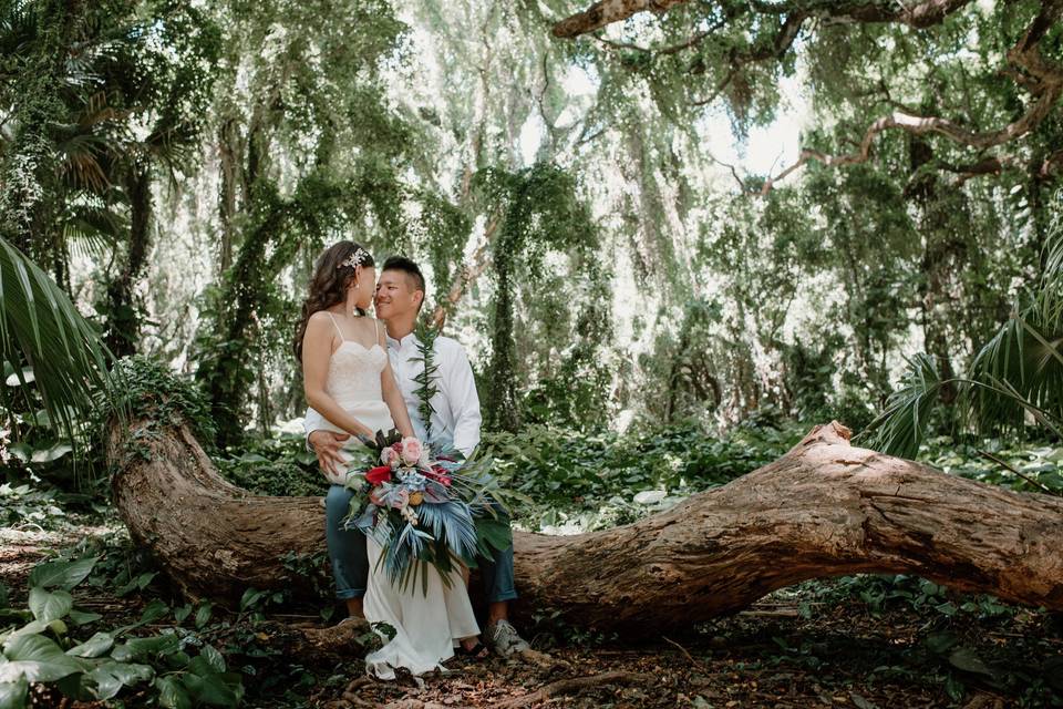 Happy couple by the trees