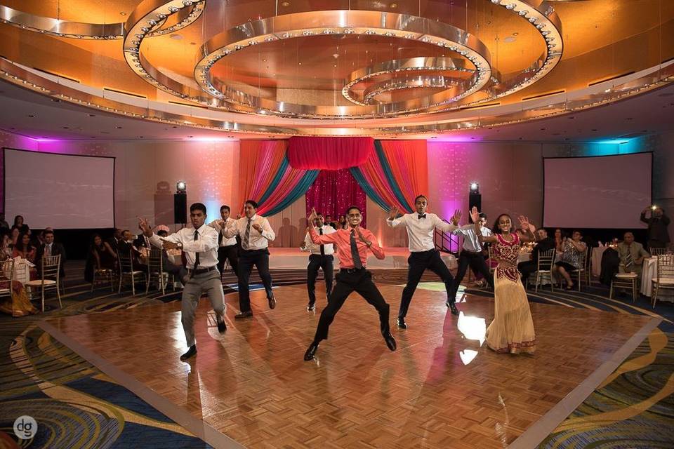 Groom and groomsmen dancing