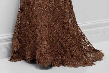 117d71off-the-shoulder tulle and embroidered lace slim a-line gown with front and back hand-beaded lace necklines, scalloped lace hemline, slight sweep train. Sizes4 – 20, 16w– 26w colors bronze, wedgwood