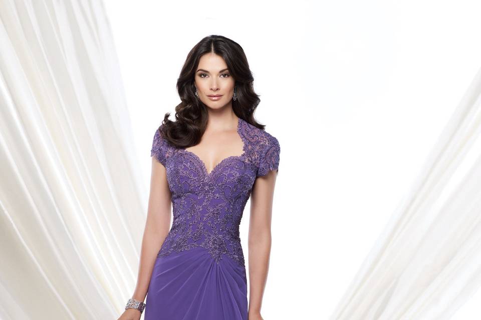 215900cap sleeve two-tone chiffon and metallic lace a-line gown with deep v-neckline, metallic lace bodice, keyhole illusion back, gathered chiffon skirt with sweep train. Matching shawl included. Sizes4 - 20, 16w - 26wcolors royal blue, dark aqua, pink sapphire