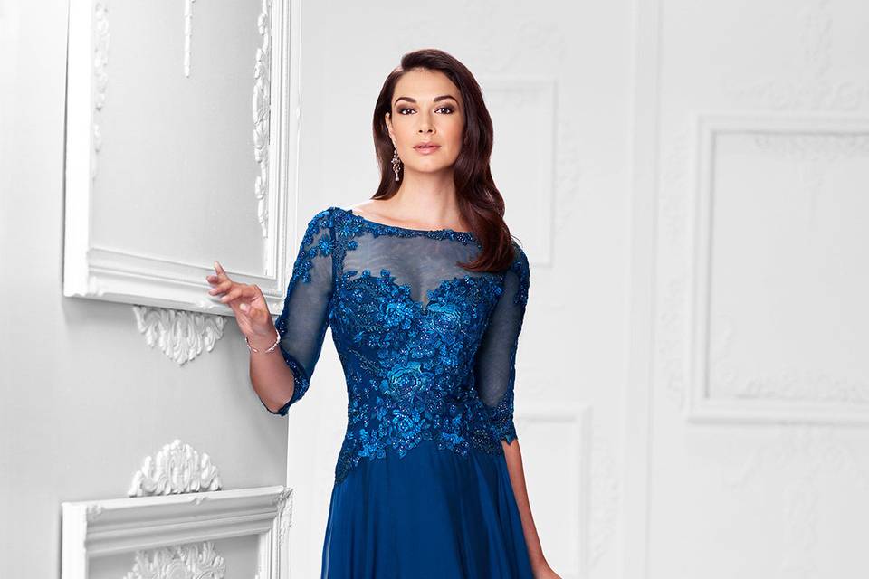 117901two-tone chiffon a-line gown with hand-beaded lace and illusion three-quarter length sleeves, lace trimmed illusion bateau neckline, beaded floral lace sweetheart bodice, illusion v-back, softly gathered skirt sweep train. Sizes 4 - 20, 16w - 26w colorsnavy blue, blush, pewter