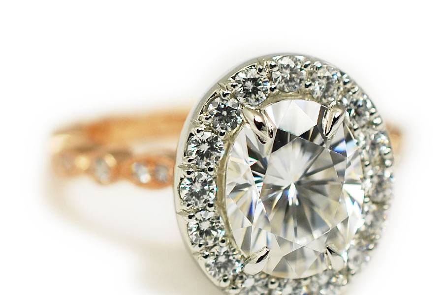 Rose gold and platinum custom engagement ring featuring 2 carat center diamond and diamond accents - The Caroline