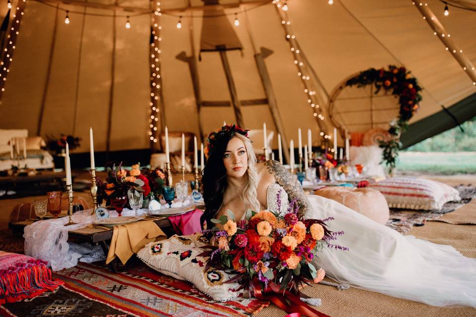 Bride lying down by the table | Brittyn Elizabeth Photography