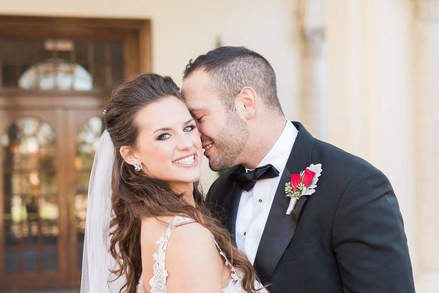 Groom holding his bride