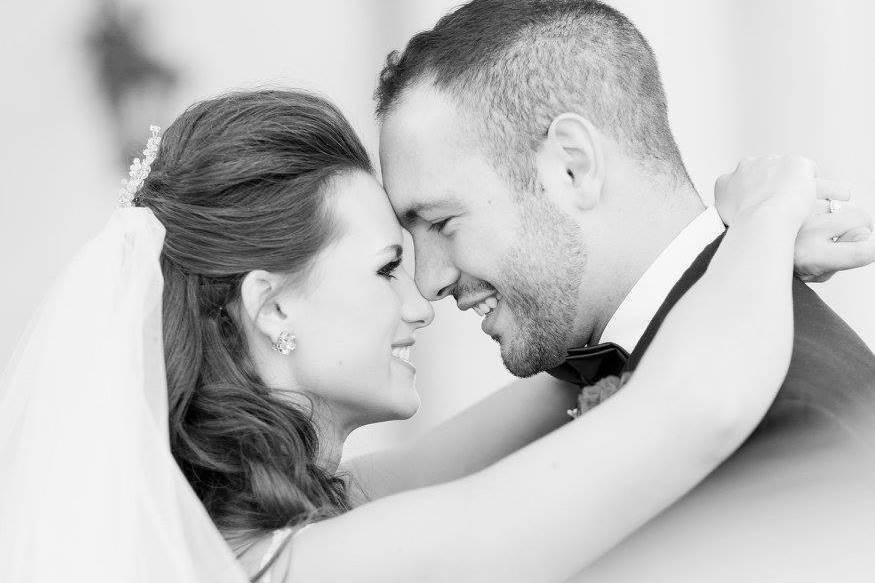 Groom holding his bride