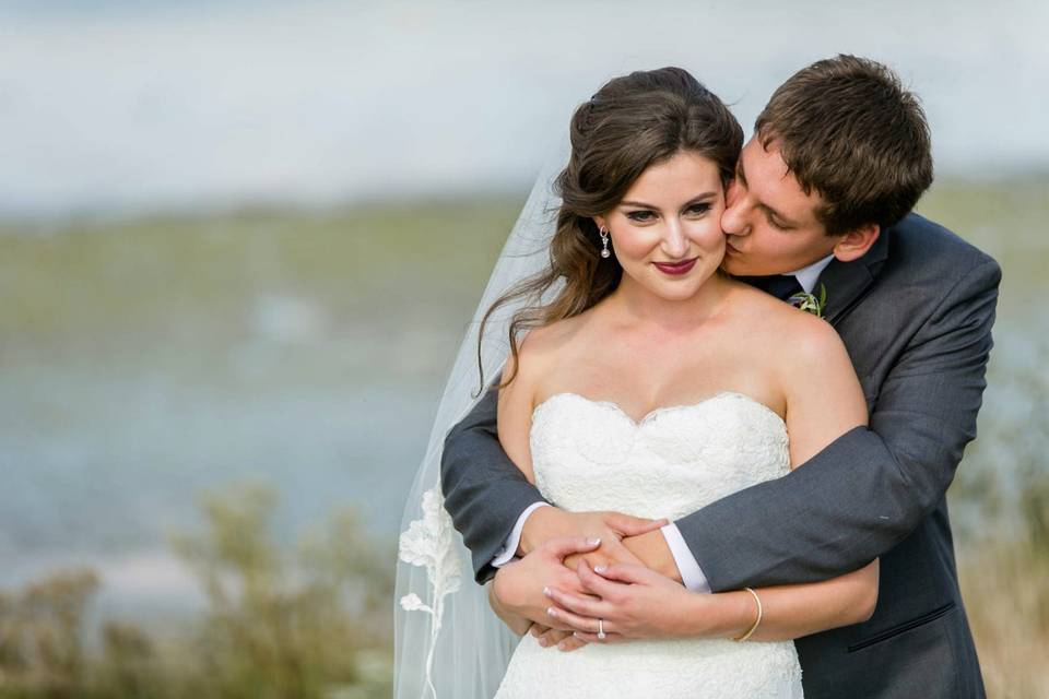 Groom kissing his bride