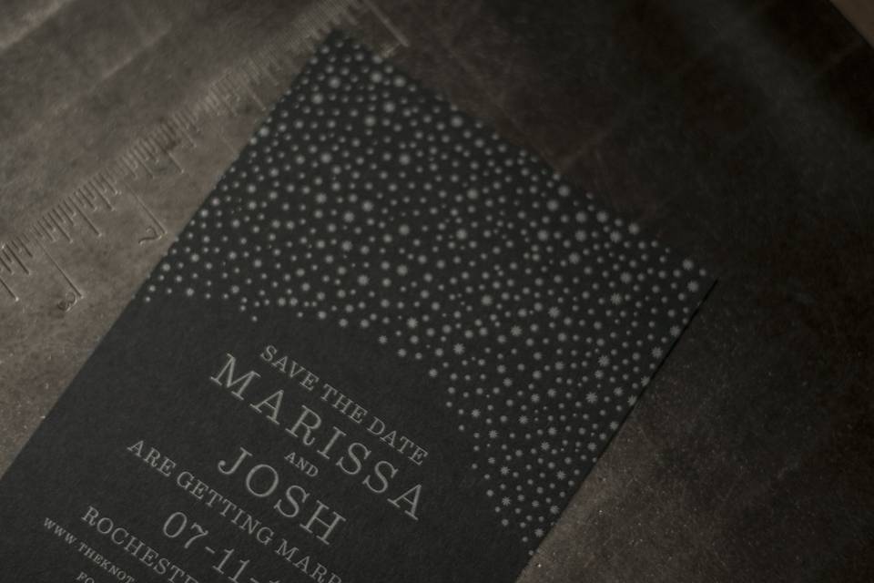 A beautiful save-the-date with silver ink on black paper