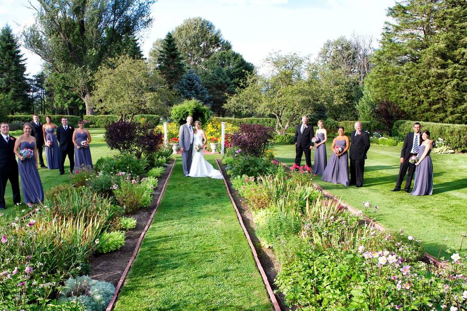 Newlyweds and their guests in the garden