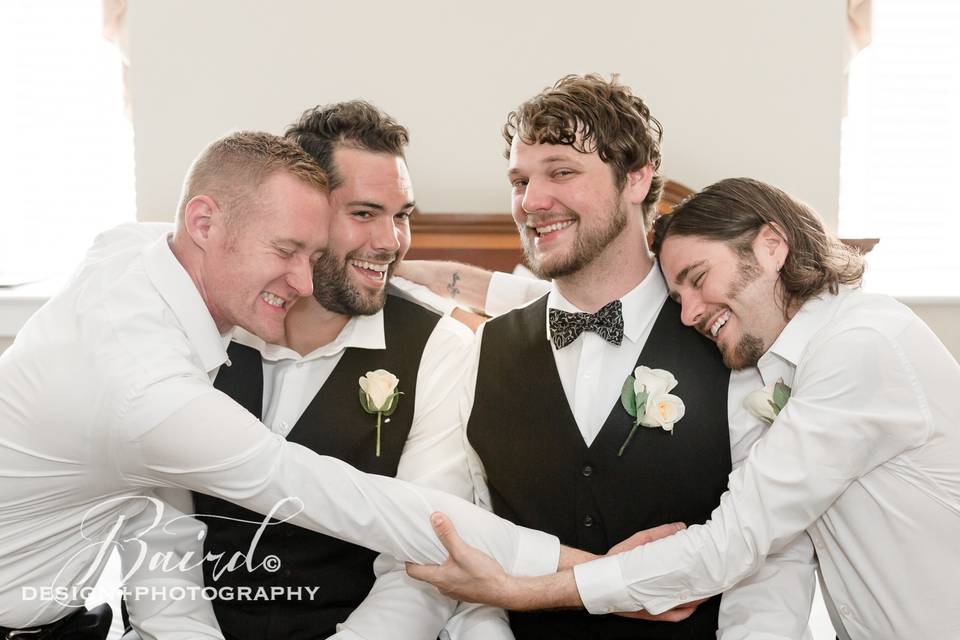 The groomsmen sharing some lov