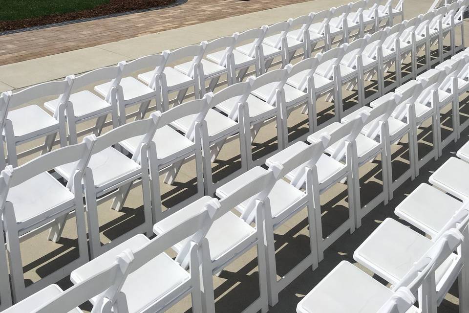 Ceremony set with white chairs