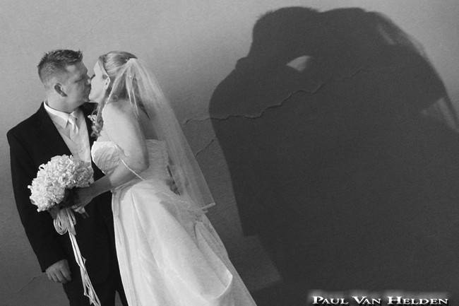 These newlyweds are shadow kissing, at a private home in the foothills, Tucson, Arizona.