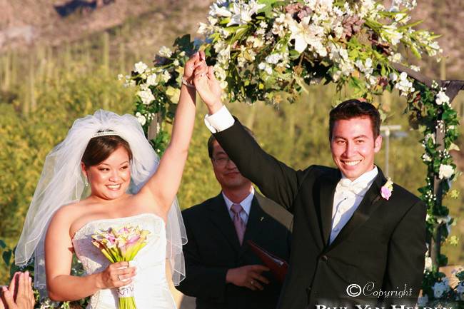 Amanda and Charles hail the crowd, after exchanging wedding vows at Tanque Verde Ranch, in Tucson.