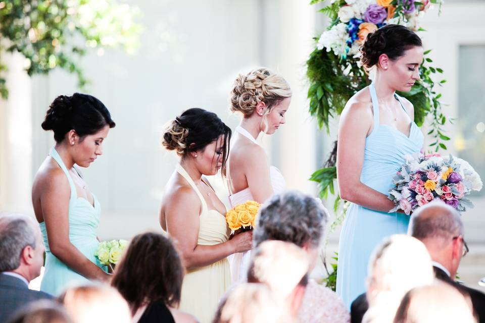 Praying bridesmaids