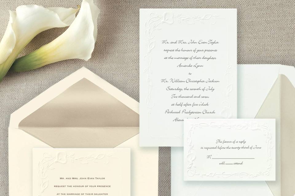 Calla Lilies - A traditional wedding invitation featuring classic calla lilies embossed on bright white card stock. Simply select the wedding invitation wording that perfectly fits your style. Exclusively Weddings offers this invitation accented in your choice of purple or wine. Order Your Free Sample Today!