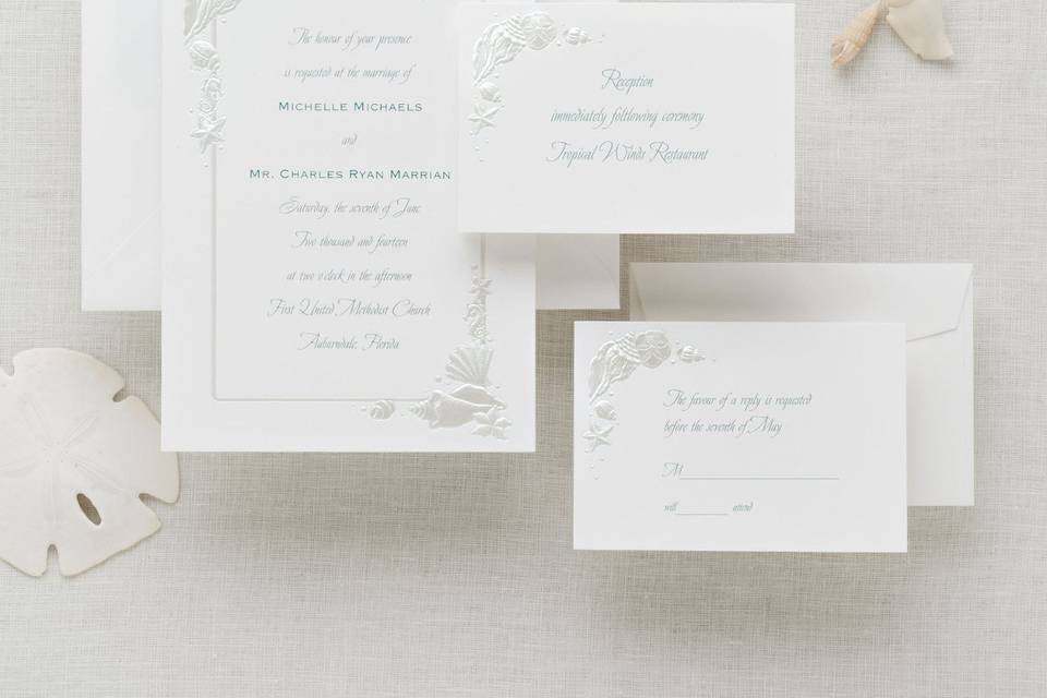 Sea Treasures - This Exclusively Weddings invitation has a subtle border of pearlized seashells on bright white paper. It will add a unique touch to your beach or summer theme wedding. Order Your Free Sample Today!