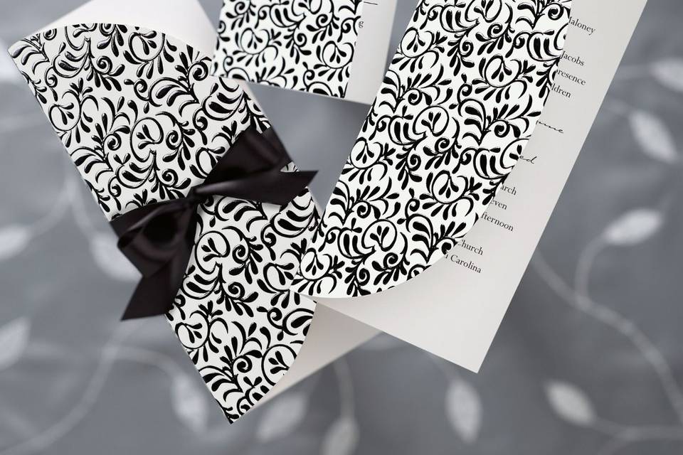 Brocade - Inspired by the opulent brocade fabric used in the most distinctive wedding gowns, this wedding invitation design adds striking beauty. Foil stamped and embossed, the softly curling black-and-white vine motif is shimmery and impressively textured. Order Your Free Sample Today!