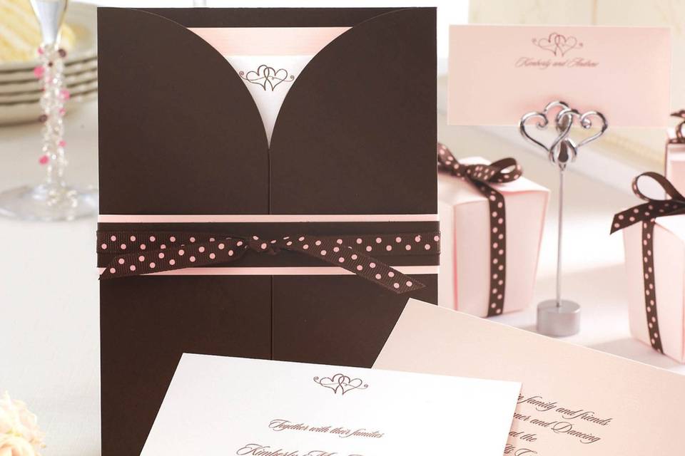 Wrapped in Romance - Designed by Exclusively Weddings, this all-inclusive wedding invitation ensemble has everything you need: invitation, reception card. response card and belly bands. No need to purchase additional pieces...Everything is included! Shown in the brown/pink combination here, this invitation is available in 7 additional color choices. Order Your Free Sample Today!