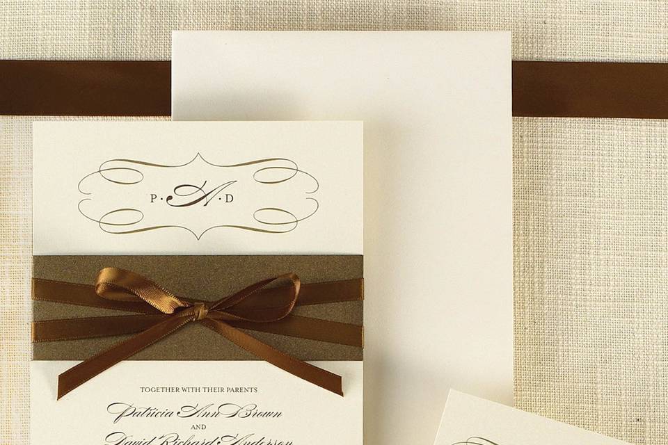 Milan Bride- A chic band of deep metallic color highlights the creamy pearlized paper stock. This sleek wedding invitation is part of the Uptown Bride collection from Exclusively Weddings, full of sophistication and style. Available in Pearlized Latte and Pearlized White. Order Your Free Sample Today!
