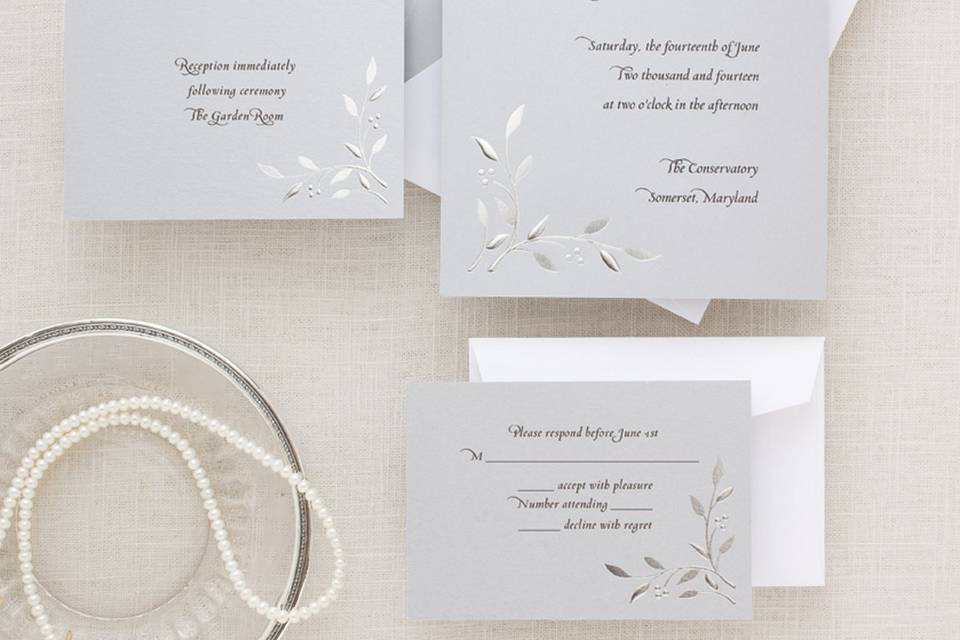 Nature's Love - Create an impression both naturalistic and elegant with this chic leaf-and-vine pattern invitation, designed by Exclusively Weddings. The motif is embossed in silver foil, giving the design a soft metallic sheen and a bit of intriguing dimension. The design coordinates perfectly with the large selection of accessories in our Nature's Love collection. Order Your Free Sample Today!