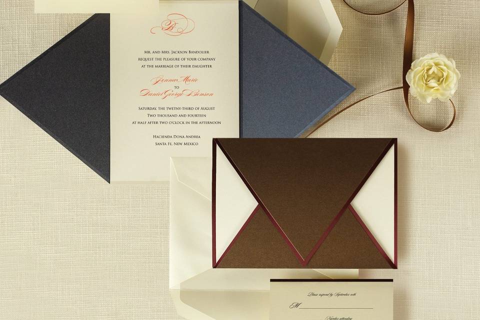 Wrapped in Love - The rich metallic folder of this bold invitation set wraps around the ensemble components. A soft metallic band edging the folder, accentuating its crisp lines, is repeated on all the matching pieces. Exclusively Weddings offers the invitation wrap in your choice of bronze or onyx. Order Your Free Sample Today!