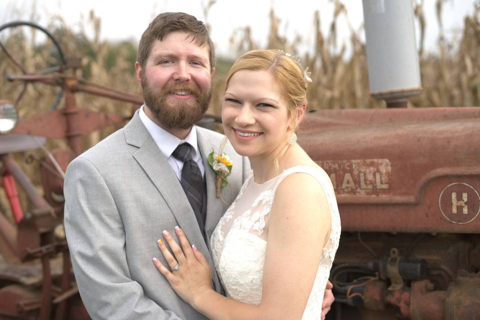 Couple in front of tractor