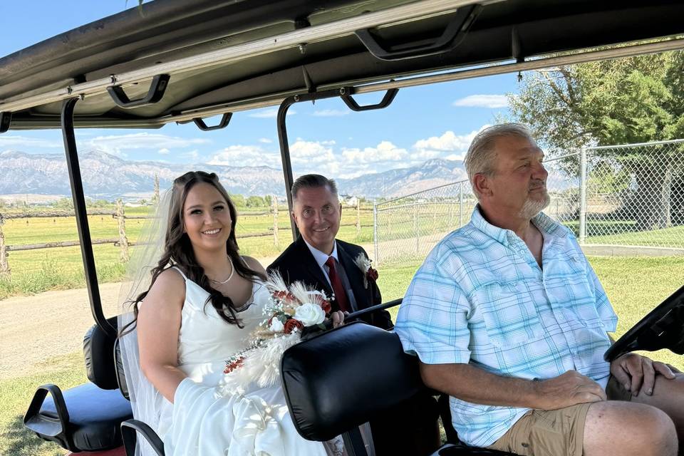 Bride with dad golf cart