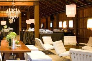 White leather lounge furniture and chairs in the Barn at Atwood Ranch. Courtesy of Julie Atwood Events.