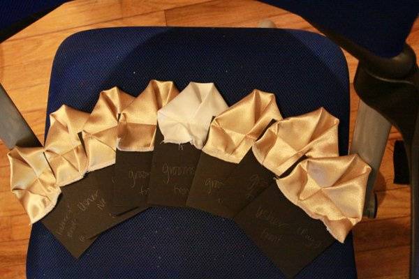 These were the pocket squares that I made for my (now) hubby and the groomsmen. I folded them and sewed them to black cardboard. They looked great and there was no chance the boys could mess them up! :-)