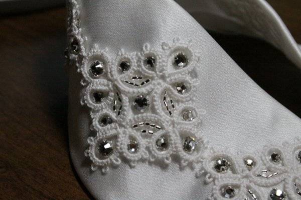 This is the tatted lace on the silk satin belt and beaded with swarovski crystals beads.
