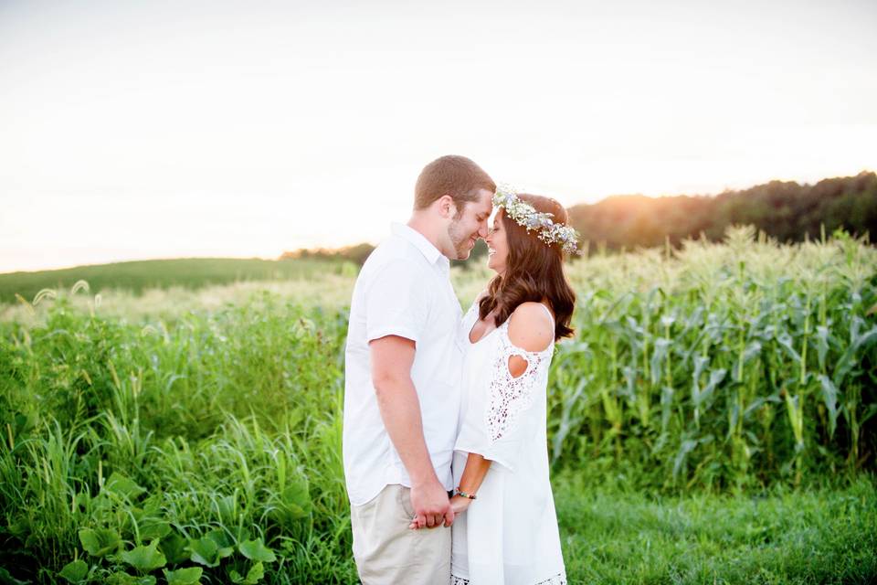 Couple kissing in a field