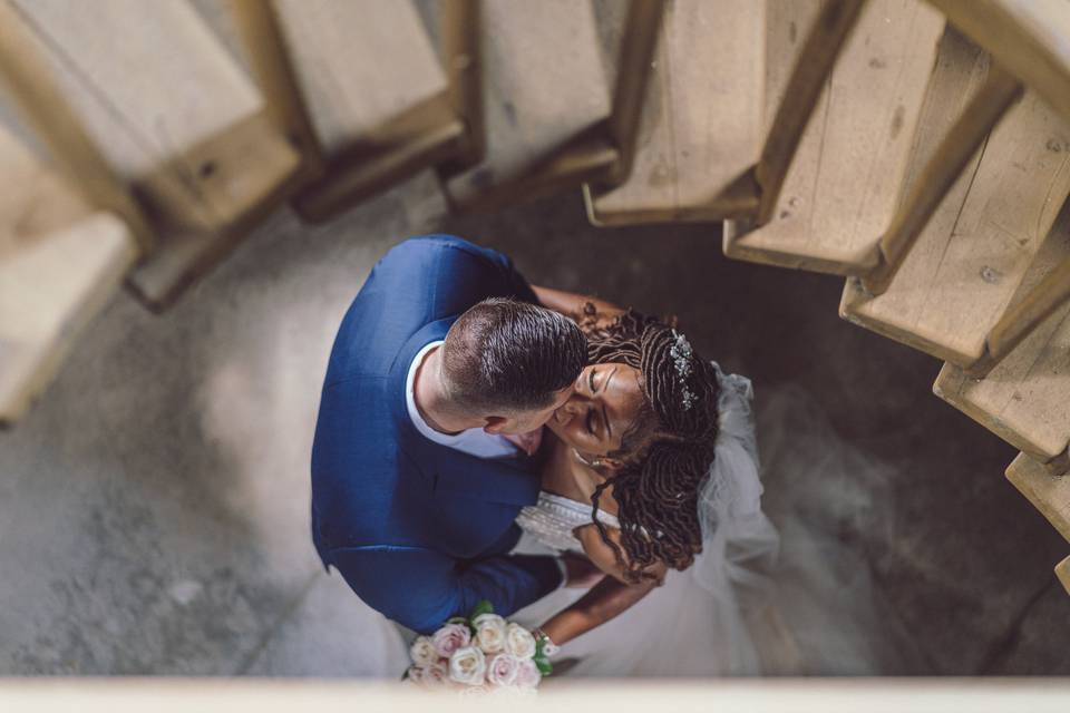 Couple under stairs