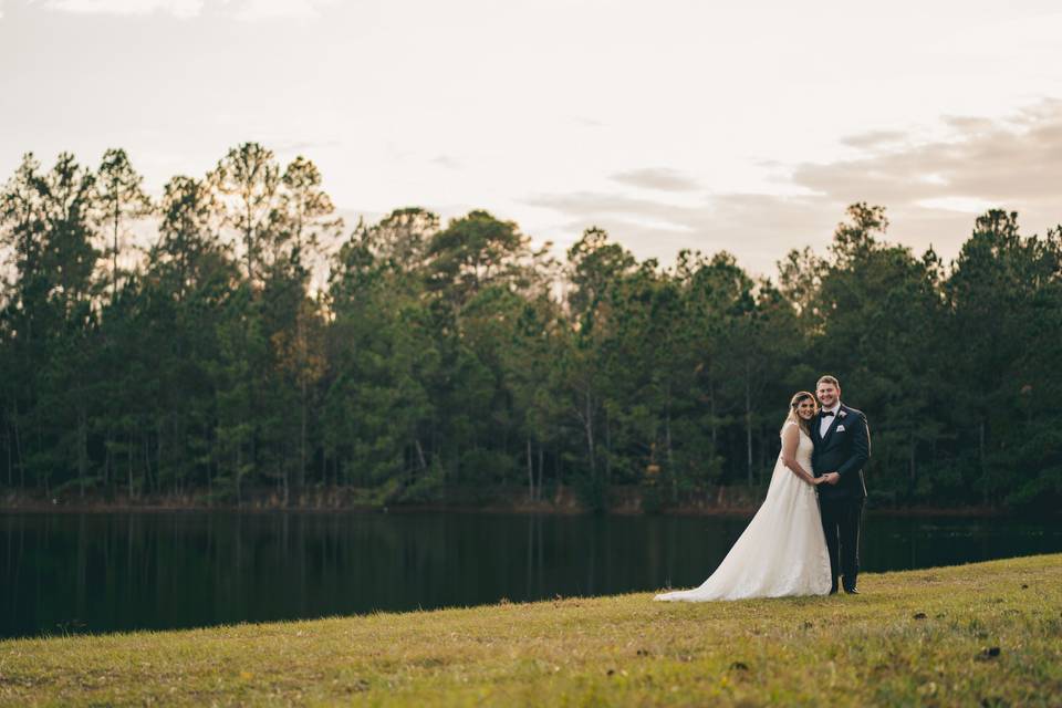 Bride and groom near lake