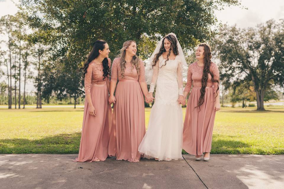 Bridesmaids holding hands