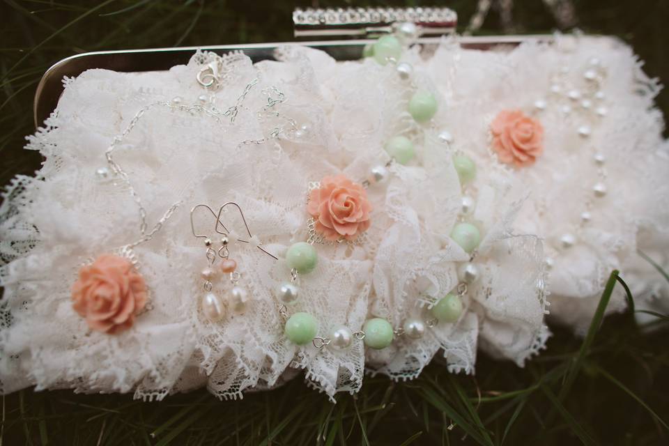 Detail photo of custom bridesmaid jewelry by J'Adorn Designs, featuring white pearls, mint mother-of-pearl, and peach floral accents.  Wedding: Kelly + ChrisLocation: Audubon, PADate: August 2012Photo by Lauren Fair Photography