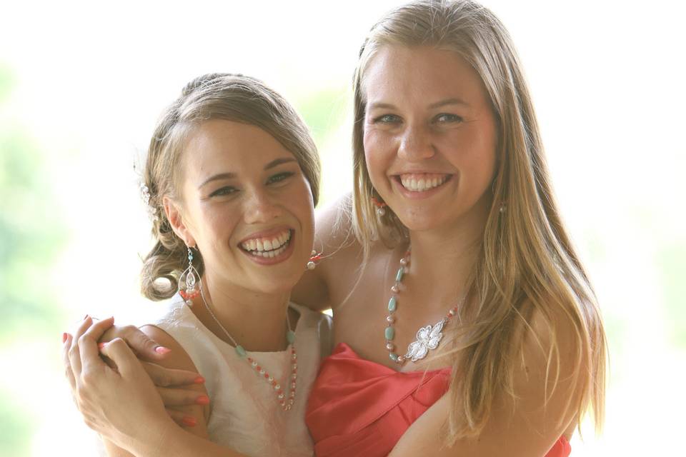 Bride Mary with her bridesmaid and friend, both wearing custom jewelry from J'Adorn Designs. Wedding: Mary + RobbyLocation: Easton, MDDate: July 2012Photo by Craig Volpe