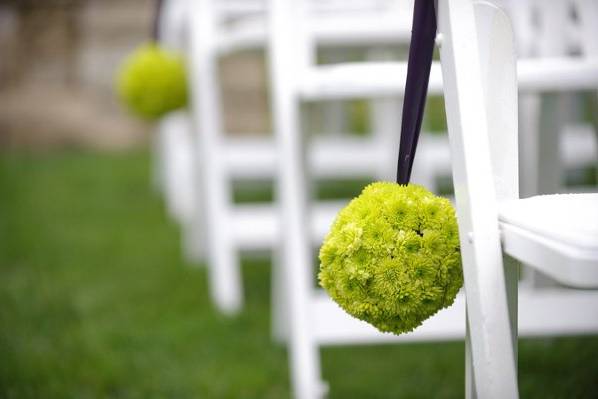 Green Mums hung with a Satin Purple ribbon adorned the aisle on a wet Saturday afternoon in October.