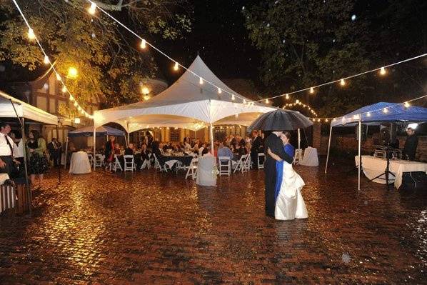 Their first dance under the stars with a few drops of rain for added drama.