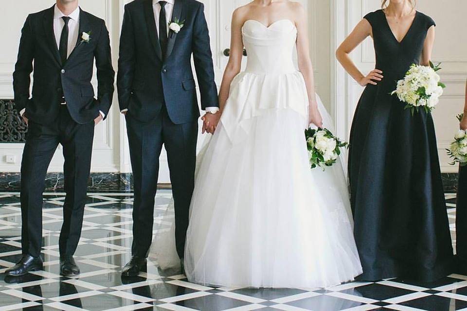 The couple with the bridesmaids and groomsmen