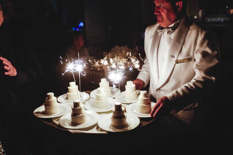 Sparklers on individual wedding cakes