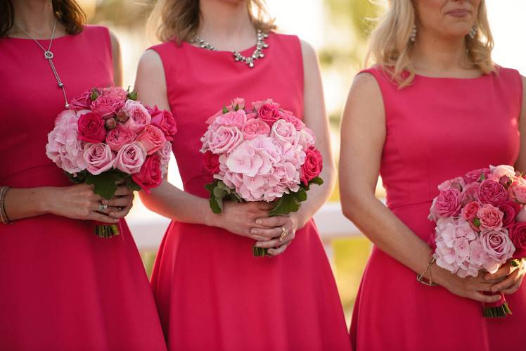 Bridesmaids with their pink garden bouquets.  Each bouquet has garden roses, spray roses and soft pink hydrangeas.