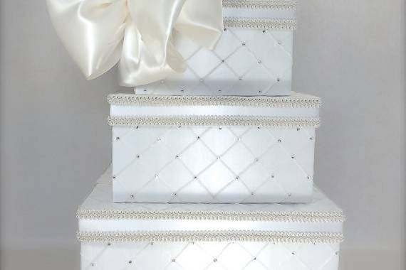 This three tier wedding card box is upholstered in ivory or white taffeta pin tuck fabric