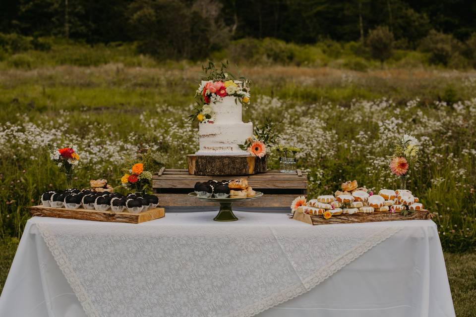 Dessert display with wedding cake