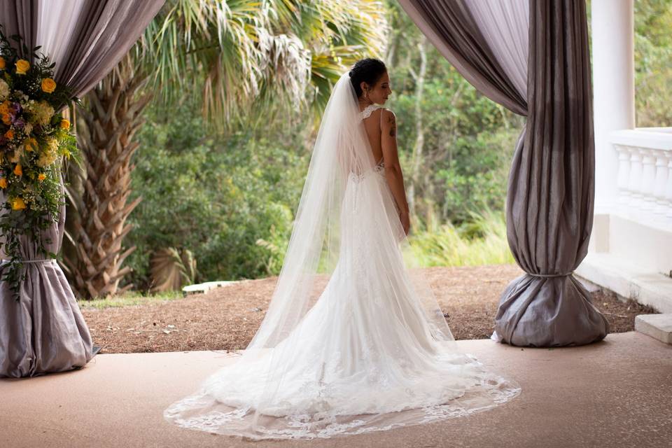 Bride under drapes