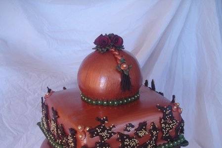 An exact replica of a designer cake with sugar roses.