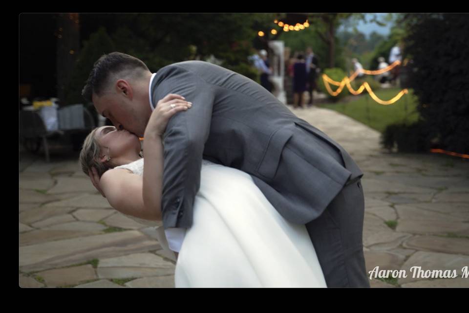 Groom dips for a kiss