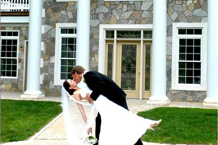 Groom kissing his bride