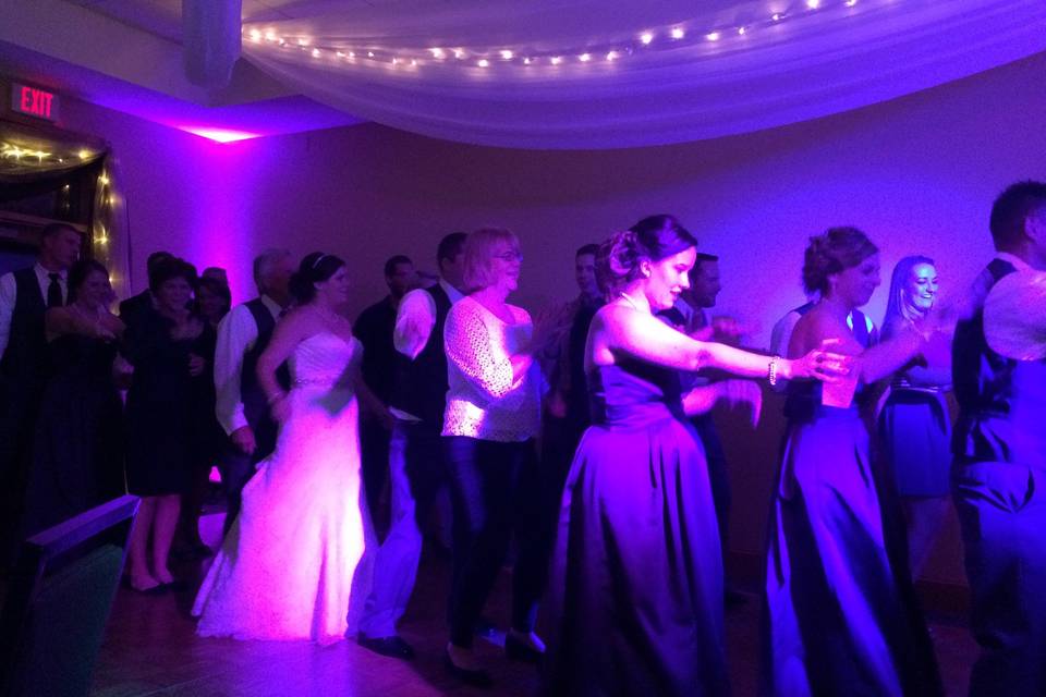 Guests dancing with the couple