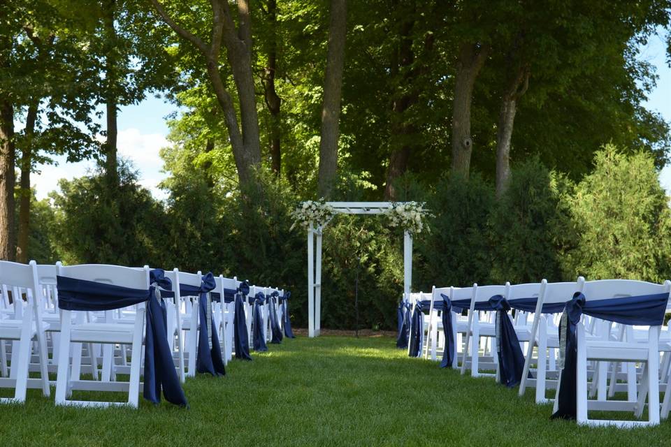 Our ceremony space. You decorate the trellis and chairs to your theme!