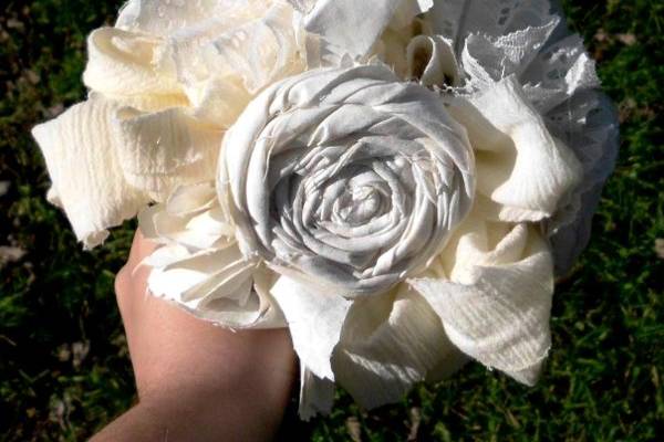 Cotton osettes, lace carnations, and cotton hydrangeas make this bouquet really speak of charm and romance.