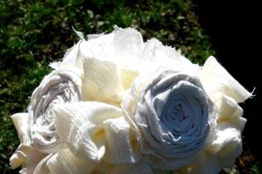 Cotton osettes, lace carnations, and cotton hydrangeas make this bouquet really speak of charm and romance.